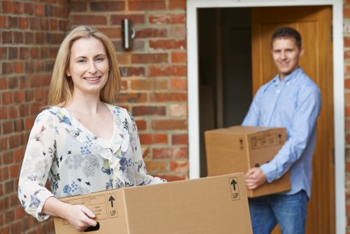 Careful loading of sofas and household furniture into a removals van