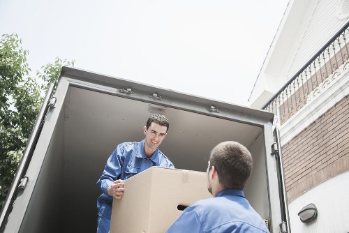 Careful wrapping and boxing of household items during packing service