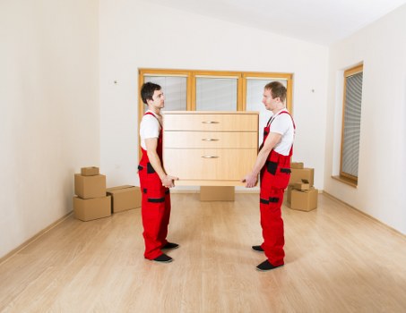 Local office moving crew handling commercial furniture in Uxbridge